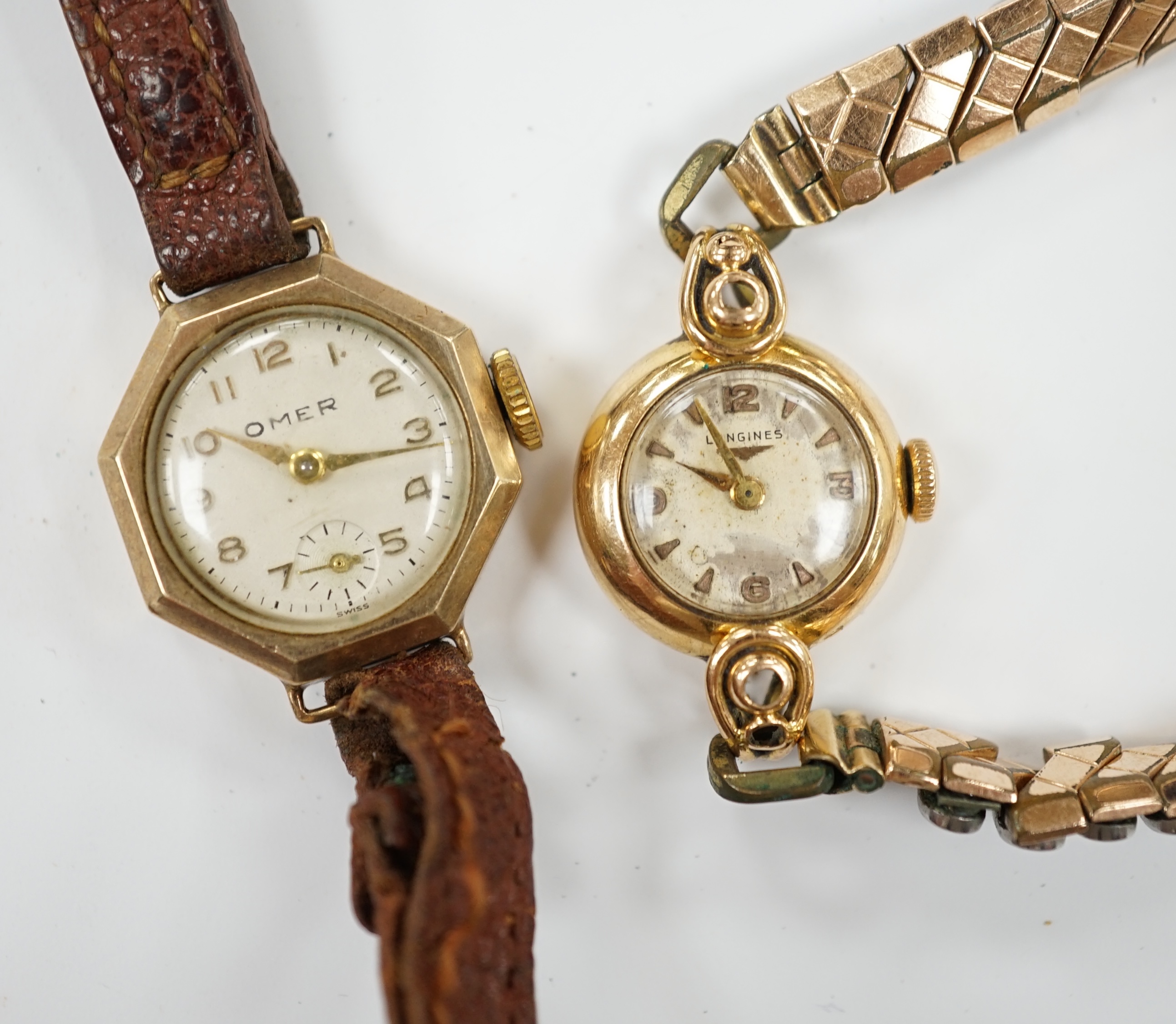 A lady's 18k Longines manual wind wrist watch, on a gold plated flexible bracelet, together with a lady's 9ct gold Omer manual wind wrist watch, on a leather strap.